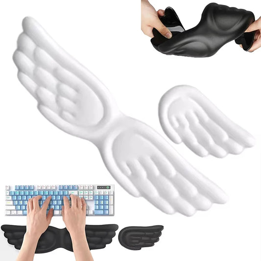 Black and white angel wing wrist rests placed in front of a keyboard