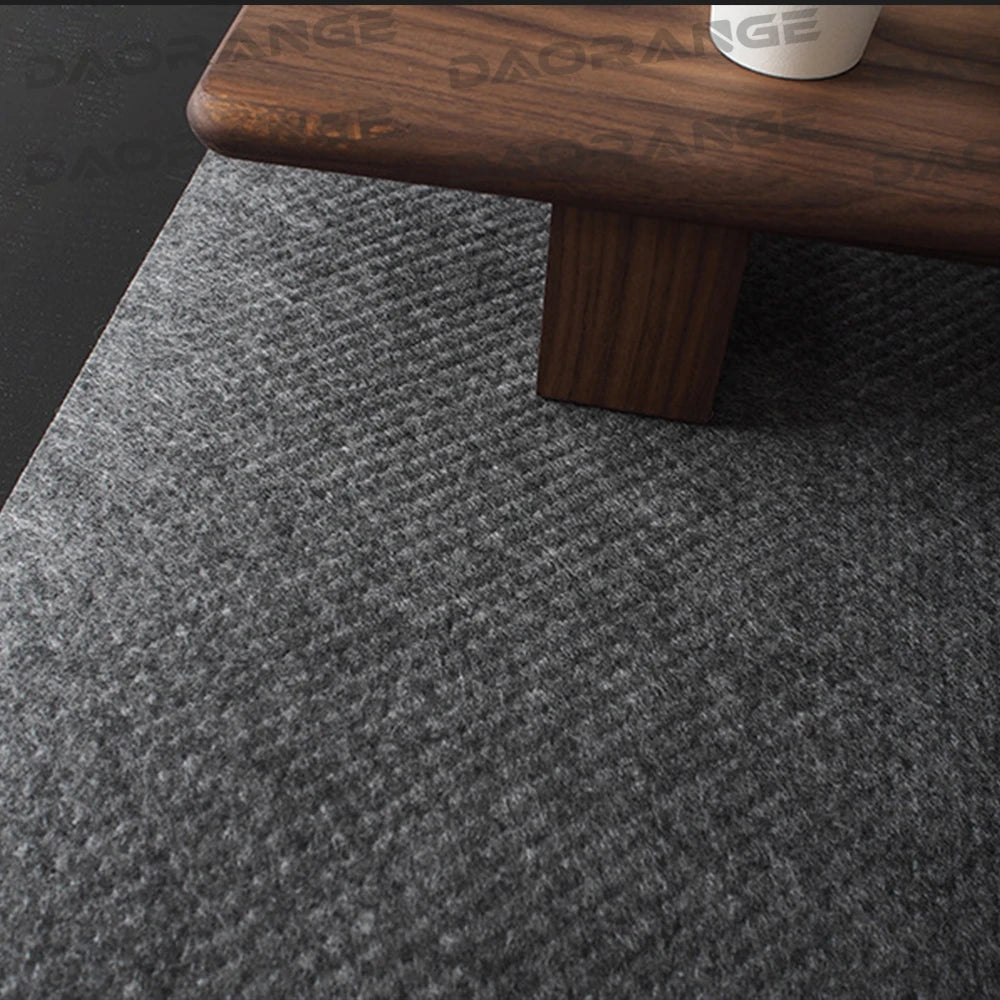 Gray felt desk mat under a keyboard and mouse on a desk
