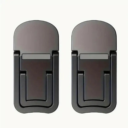 Two small foldable stick-on risers tilting the back of a laptop