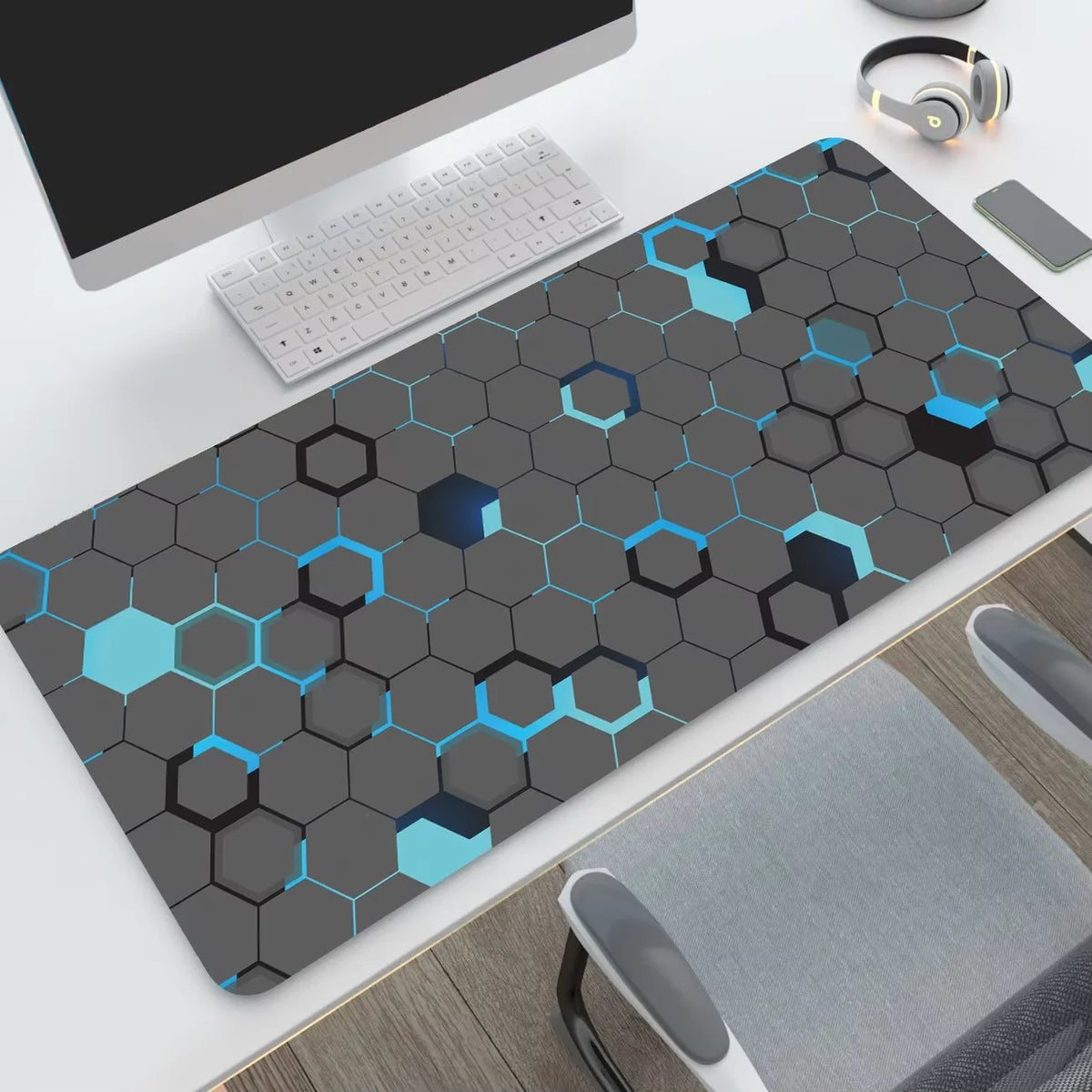 Hexagon desk mat, bright blue accents design, on a desk