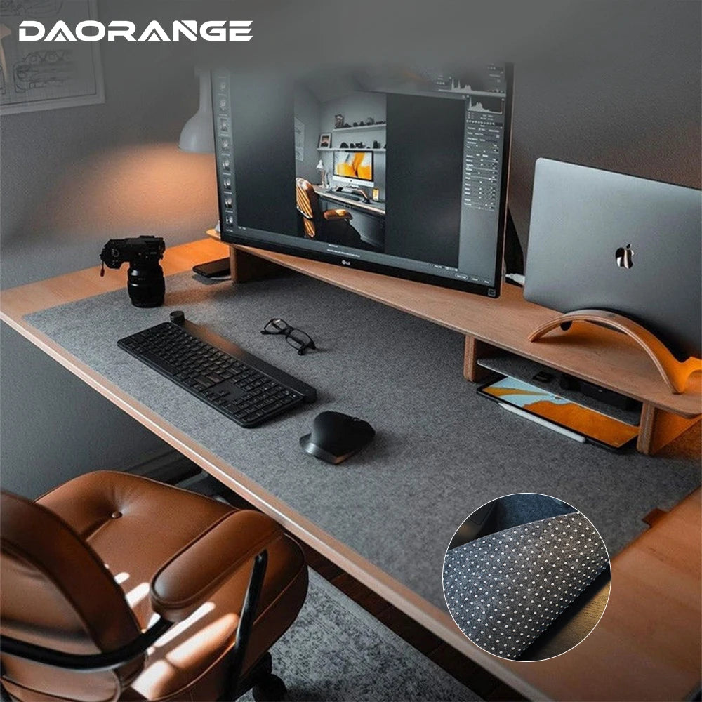 Gray felt desk mat under a keyboard and mouse on a desk