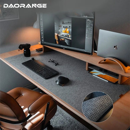 Gray felt desk mat under a keyboard and mouse on a desk
