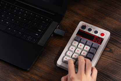 8BitDo Retro 18 mechanical numpad with its seven-segment calculator display