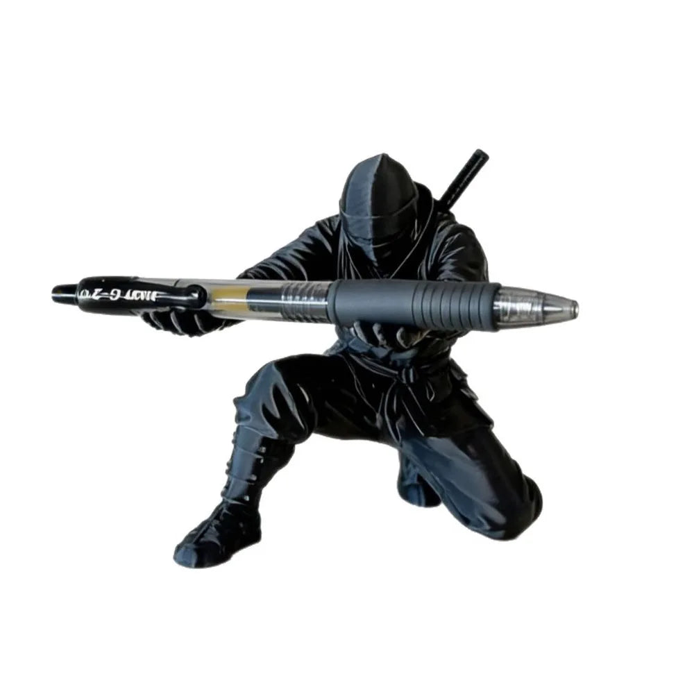 3D printed ninja figure pen holder holding pens on a desk