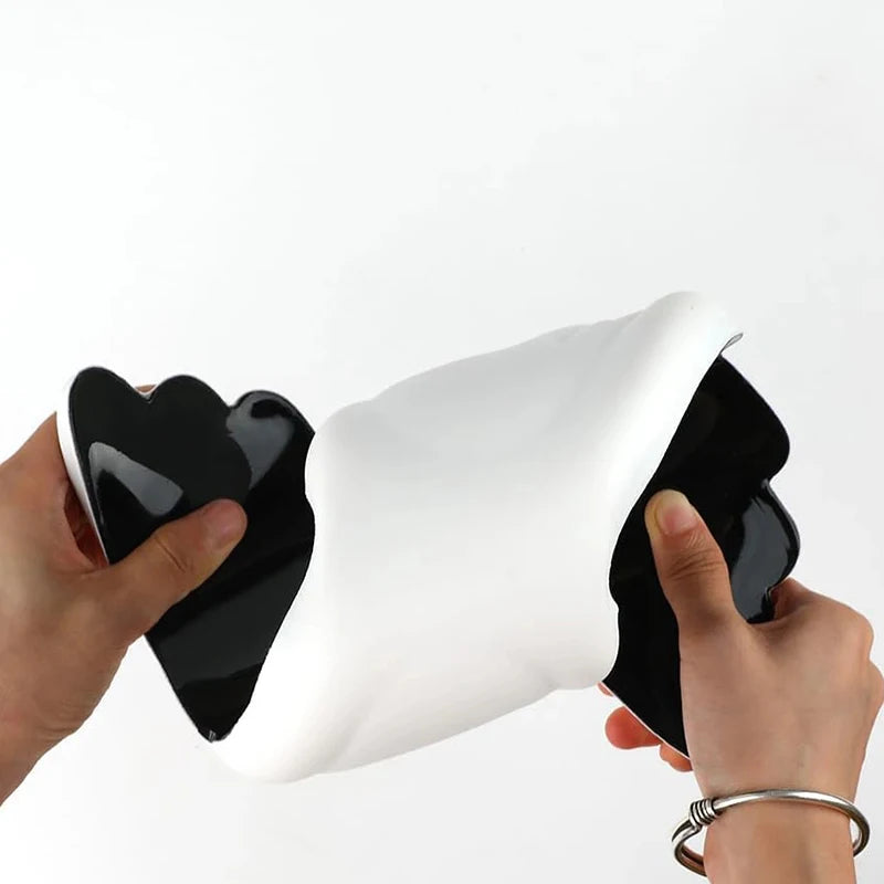 A hand squeezing the memory foam of the wrist rest