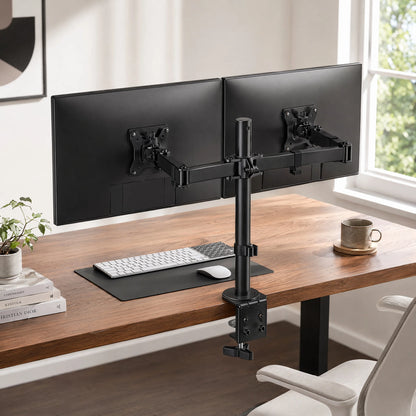 Dual monitor arm holding two screens above a desk