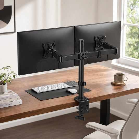 Dual monitor arm holding two screens above a desk