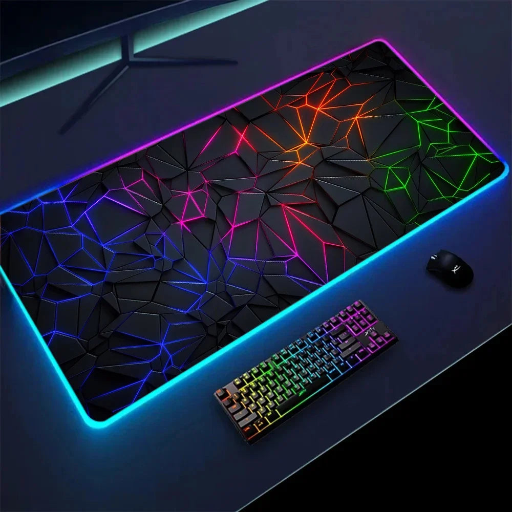 RGB desk mat with geometric print under a keyboard and mouse