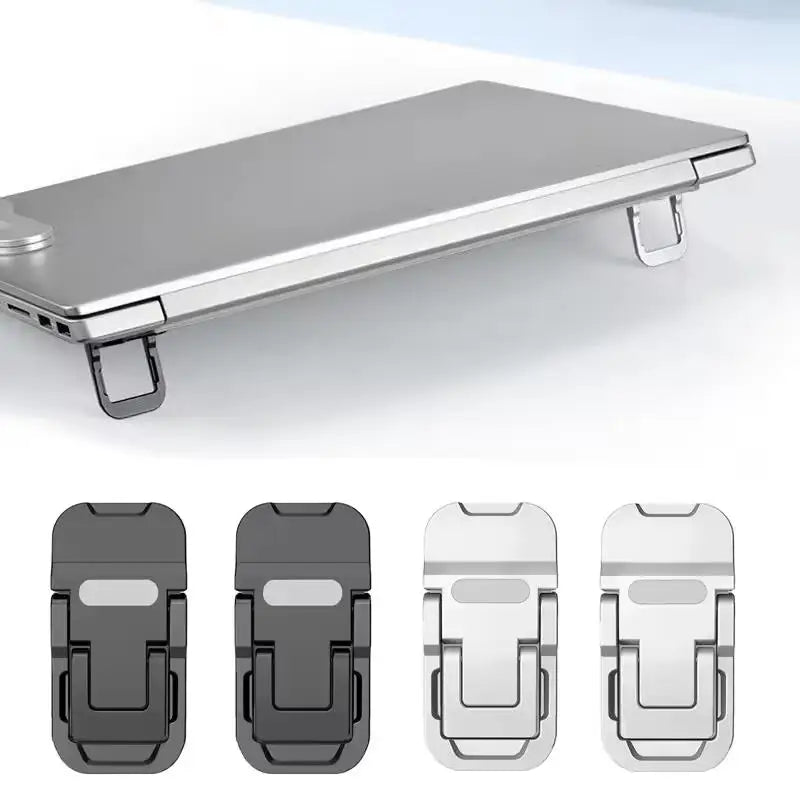Two small foldable stick-on risers tilting the back of a laptop