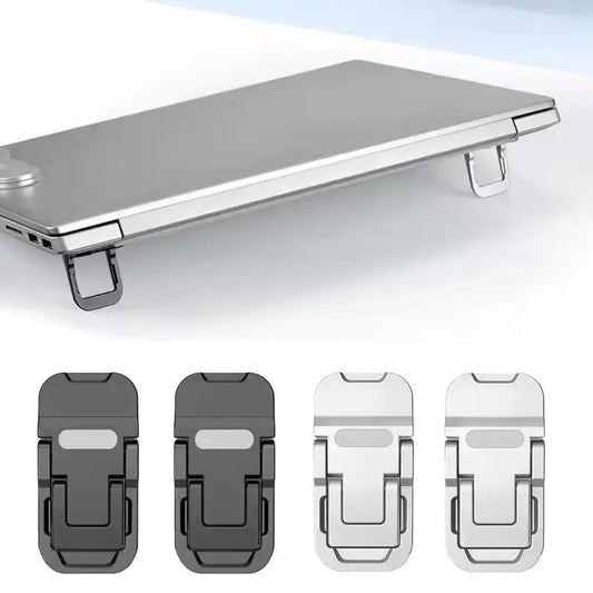 Two small foldable stick-on risers tilting the back of a laptop