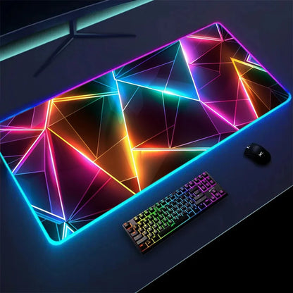RGB desk mat with a 3D geometry print, backlit, on a gaming desk