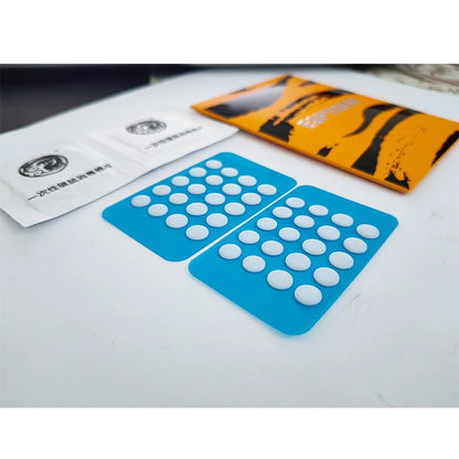 Esports Tiger universal mouse skate dots on a backing sheet