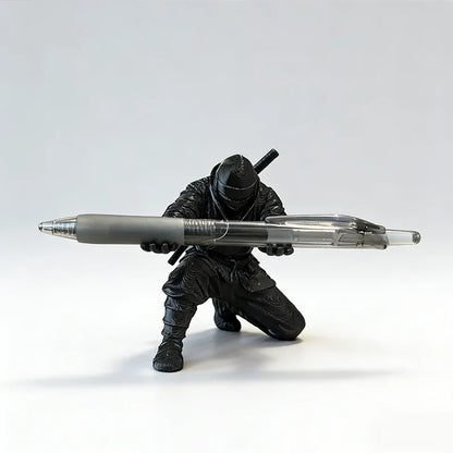 3D printed ninja figure pen holder holding pens on a desk
