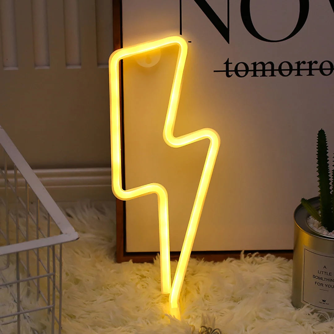 Yellow lightning bolt neon light next to a poster