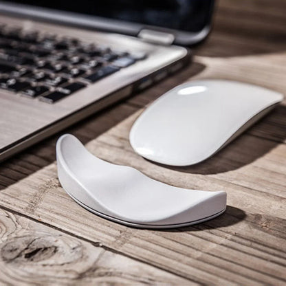 Gliding ergonomic wrist rest for right-handed mouse use