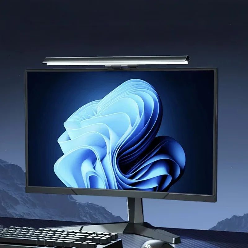Desk setup lit by the monitor light bar