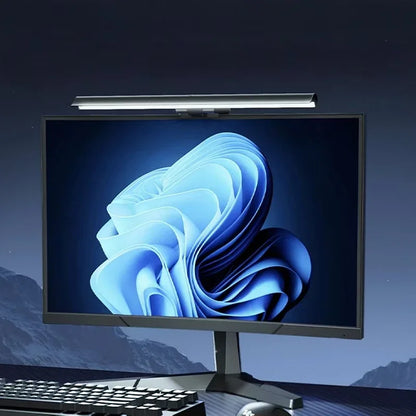 Desk setup lit by the monitor light bar