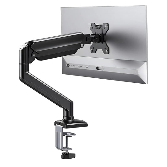 Full-motion articulated monitor arm holding a monitor above a gaming desk
