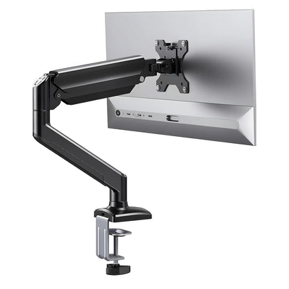 Single articulating monitor arm holding a monitor above a desk
