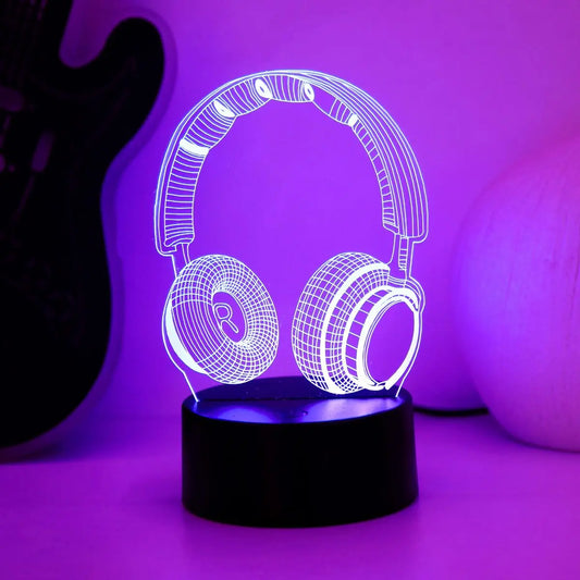 Headphones night light glowing purple on a lit base